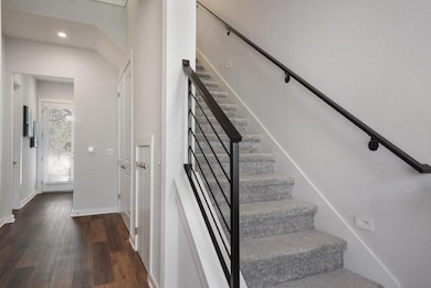 Stairs featuring recessed lighting, baseboards, a