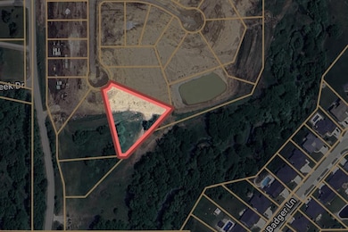 Aerial view showing the trees and creek backing to lot 57
