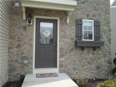 Exterior Front Beautiful entry way with custom sto