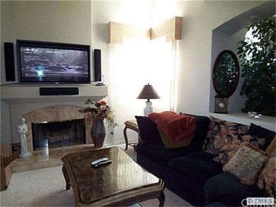 Attractive Fireplace with Travertine Tile Surround