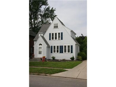 Exterior Front Well maintained  home on tree lined