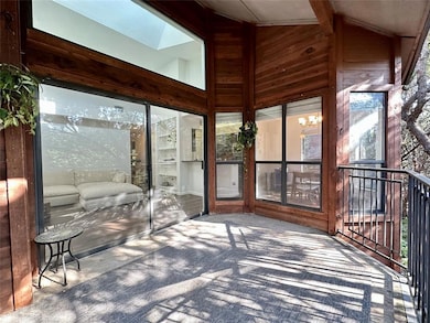 Sunroom / solarium featuring vaulted ceiling and 