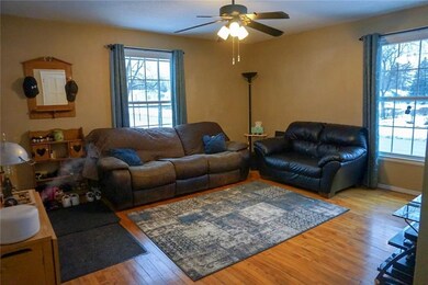 Another view of the living room and front entrance