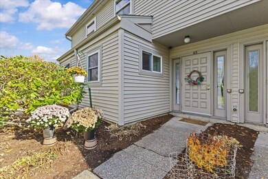 Seasonal gardens and recessed main entry to the home.