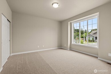 Front bedroom with glass french doors can make for a great home office/den
