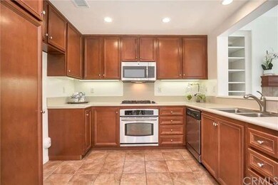 Warm Mocha Cabinets graces this open kitchen with 