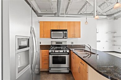 Kitchen with concrete floors, pendant lighting, da