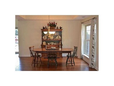 Dining Room. The bright dining room contains a tre