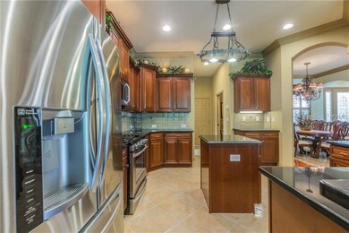 Rich wood cabinets and newer appliances are the pe