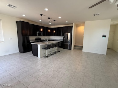 Kitchen featuring stainless steel appliances, a si