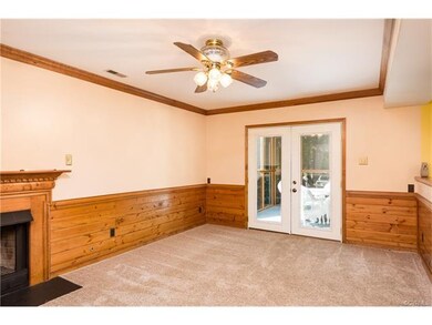 Family room with wainscoting, crown moulding, gas 