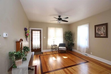 LIVING ROOM WITH THE ORIGINAL WOOD FLOORING---REFU