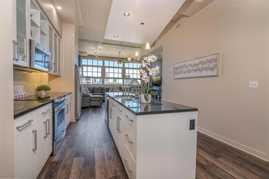 Updated flooring and white kitchen paint make this