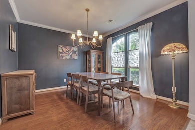 Another view of the dining room features ample nat