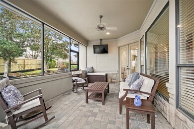 This sizable screened-in, covered patio