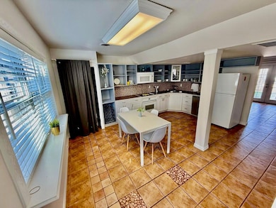 Bright eat in kitchen with plenty of cabinet space