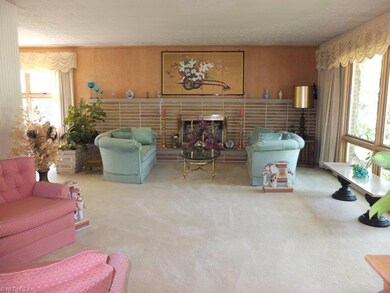 Large living room with fireplace and picture windo