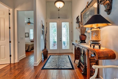Entrance foyer featuring french doors and hardwood / wood-style flooring