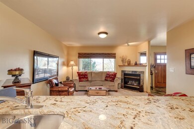 Kitchen opens to the living room with gas fireplac