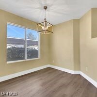 Unfurnished dining area with baseboards, an inviti