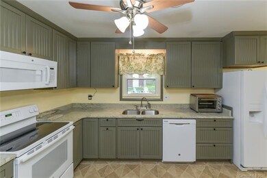 Remodeled kitchen with new cabinets and granite co