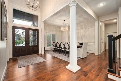 Double doors, walnut stairs and wide plank floorin