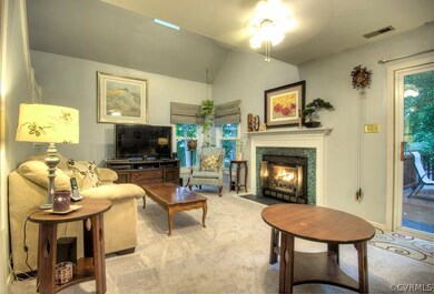 Open living room with gas fireplace.