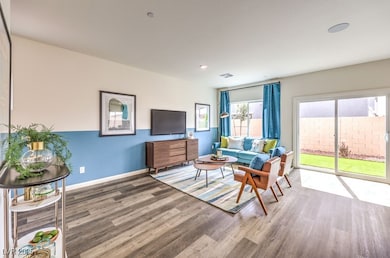 Living area featuring wood finished floors and recessed lighting
Photo is representational only; actual home finishes may vary.