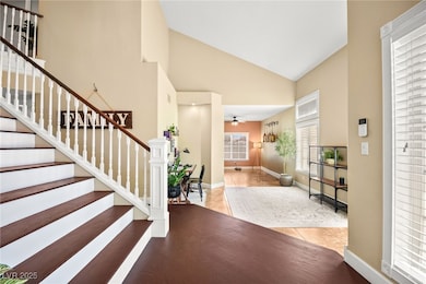 High Ceiling Entry Way & Newly Refinished Stairs