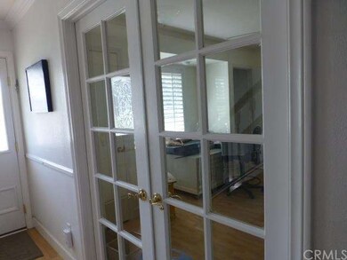 Downstairs bedroom right off the entry. Wide Frenc