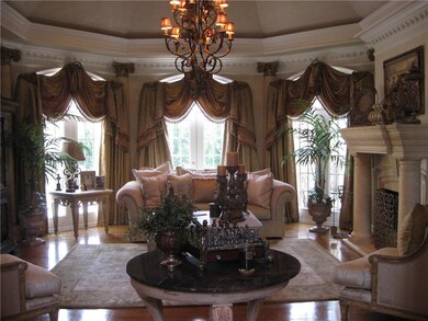 Living area featuring a chandelier, wood finished 
