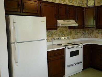 Kitchen. Includes stove & refrigerator.