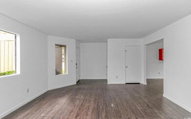 Spare room featuring dark hardwood / wood-style fl