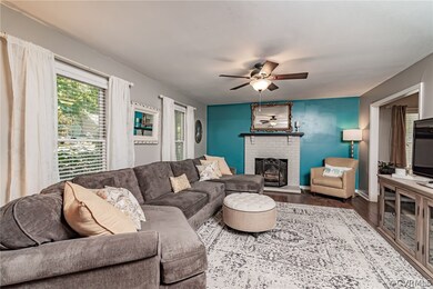 Living room features a wood burning fireplace, Ham