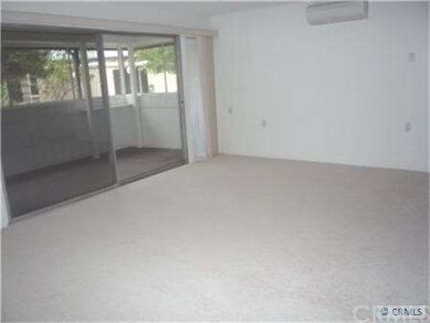 Living room with view of screened in porch
