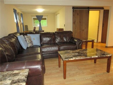 Additional view of the living room, plus the den a