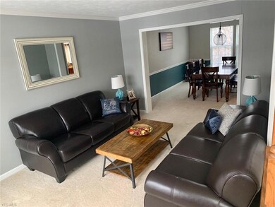 Living room area with view of dining room