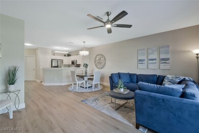 Living room featuring baseboards, light wood-type