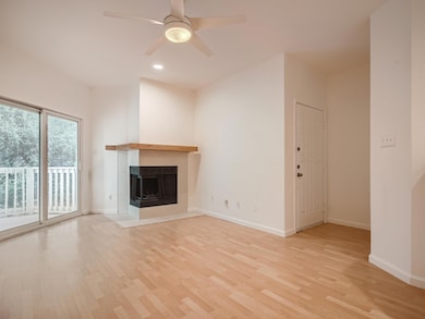 Unfurnished living room with light wood-style flo