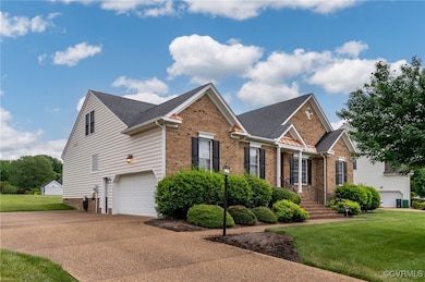 View of front of home with brick siding, a front l