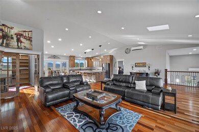 Living room featuring visible vents, lofted ceilin