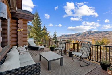 Deck with outdoor lounge area and a mountain view