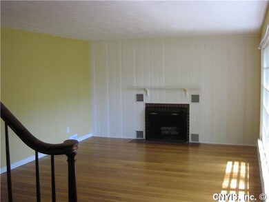 Exterior Front. Living room with fireplace, pegged