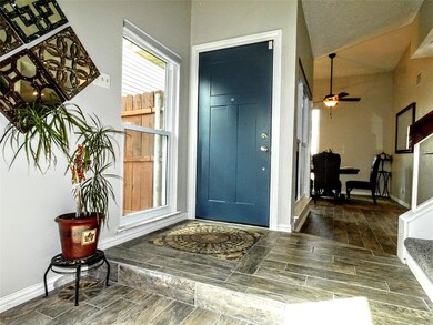Property entrance with custom tile floor design.