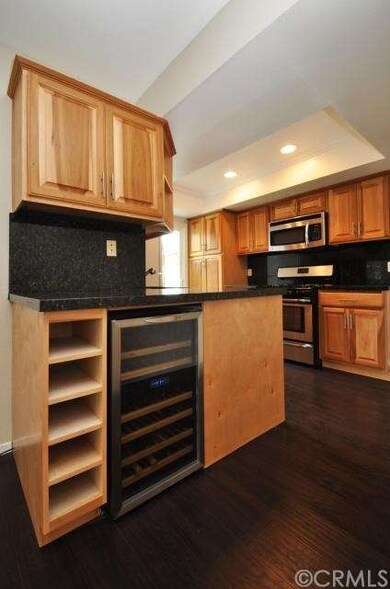 Kitchen with stainless steel appliances and wine c