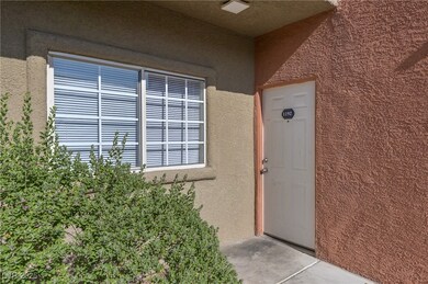 View of exterior entry with stucco siding