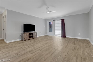 Unfurnished living room with crown molding, ceilin