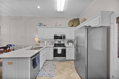 Kitchen with stainless steel appliances, a sink, a