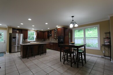 Breakfast area in kitchen is large enough for a nice size table and chairs plus you have a formal dingin room as well.  Kitchen has a walk in pantry that is larger than most! 