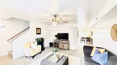 Large living area with storage under the stairs allows for relaxing and plenty of seating areas.